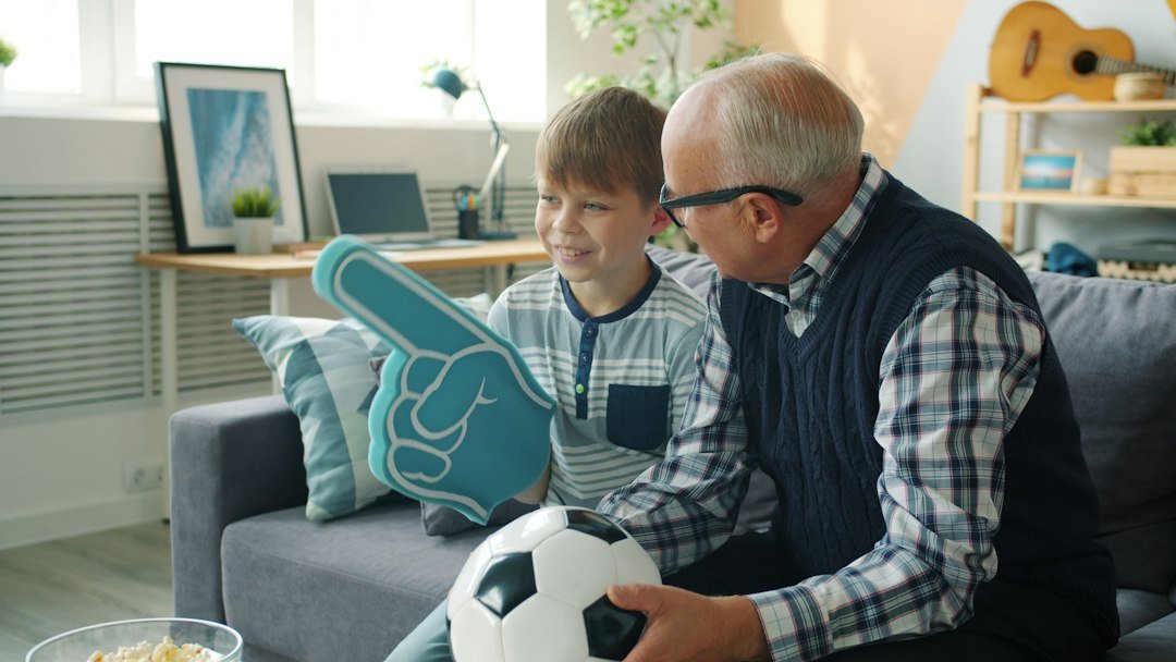 Family enjoying television at home for IPTV versus cable comparison